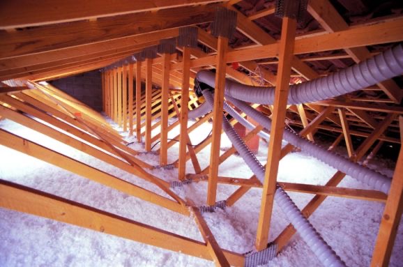 Team installing blow-in insulation