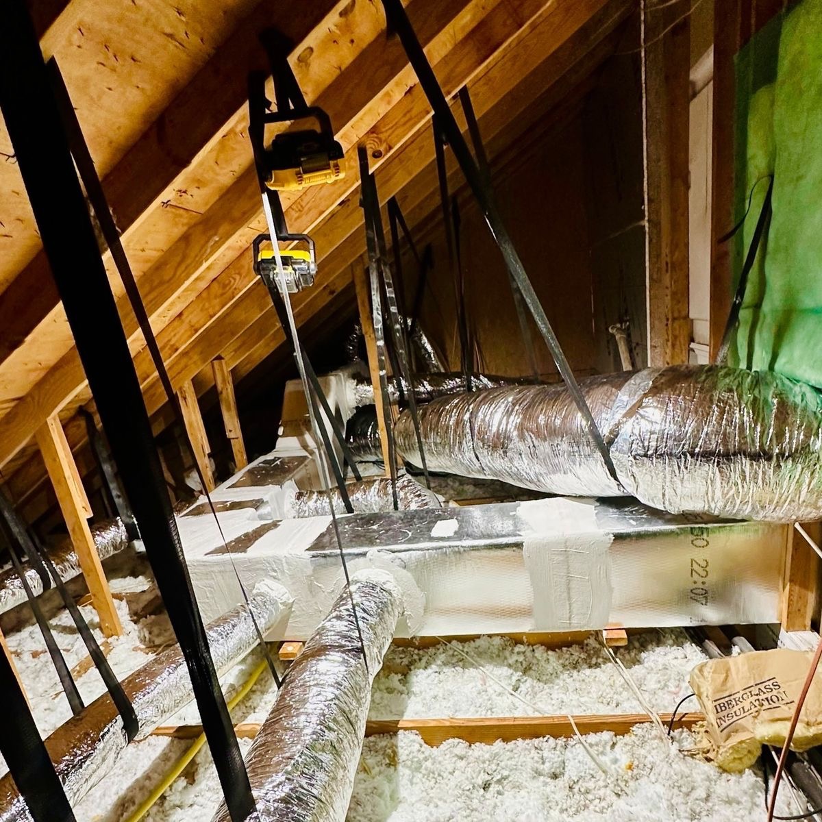 Team installing blow-in insulation